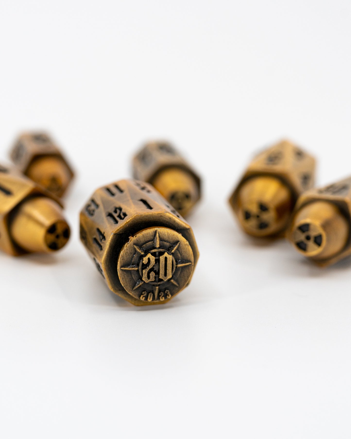 Alpha | Brass Bullets | 7 Piece Metal Dice Set