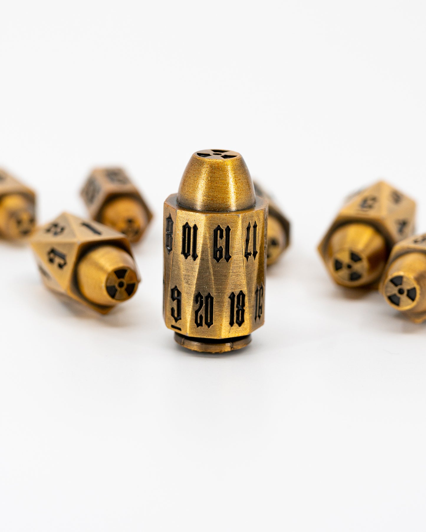 Alpha | Brass Bullets | 7 Piece Metal Dice Set