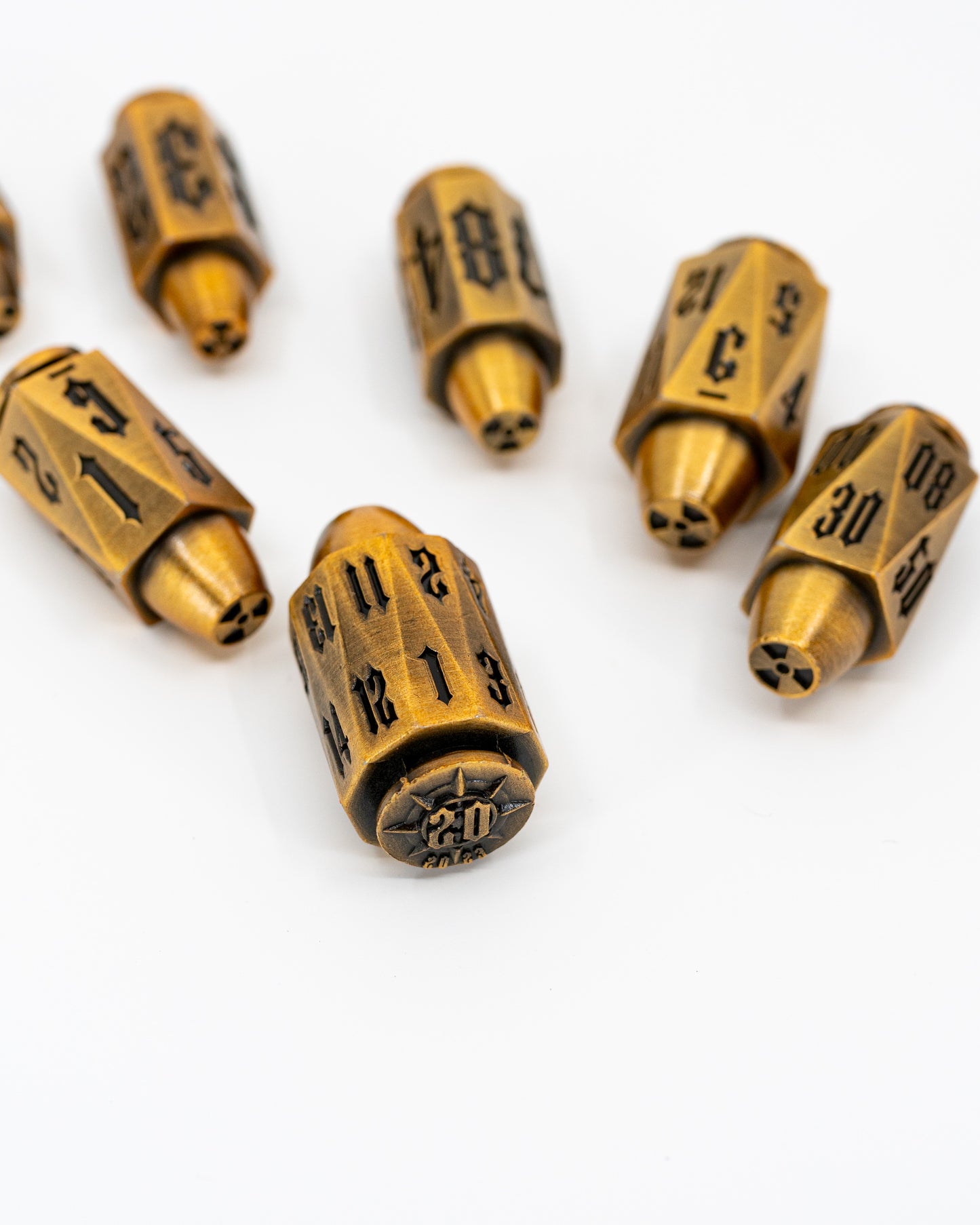 Alpha | Brass Bullets | 7 Piece Metal Dice Set